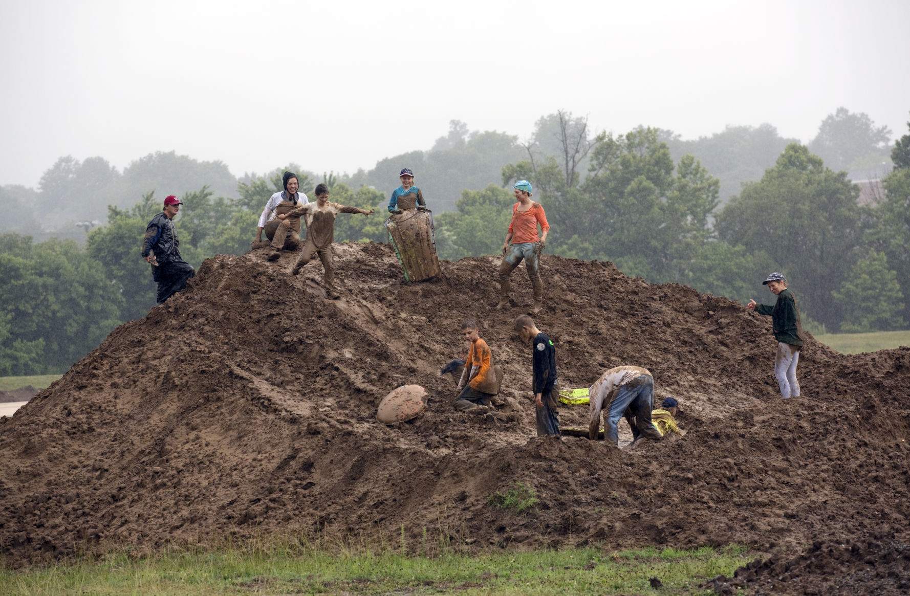 Playing in the mud at a rainy River's Edge